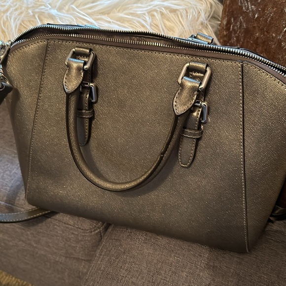 Michael Kors silver purse also worn as crossbody. - Picture 2 of 4